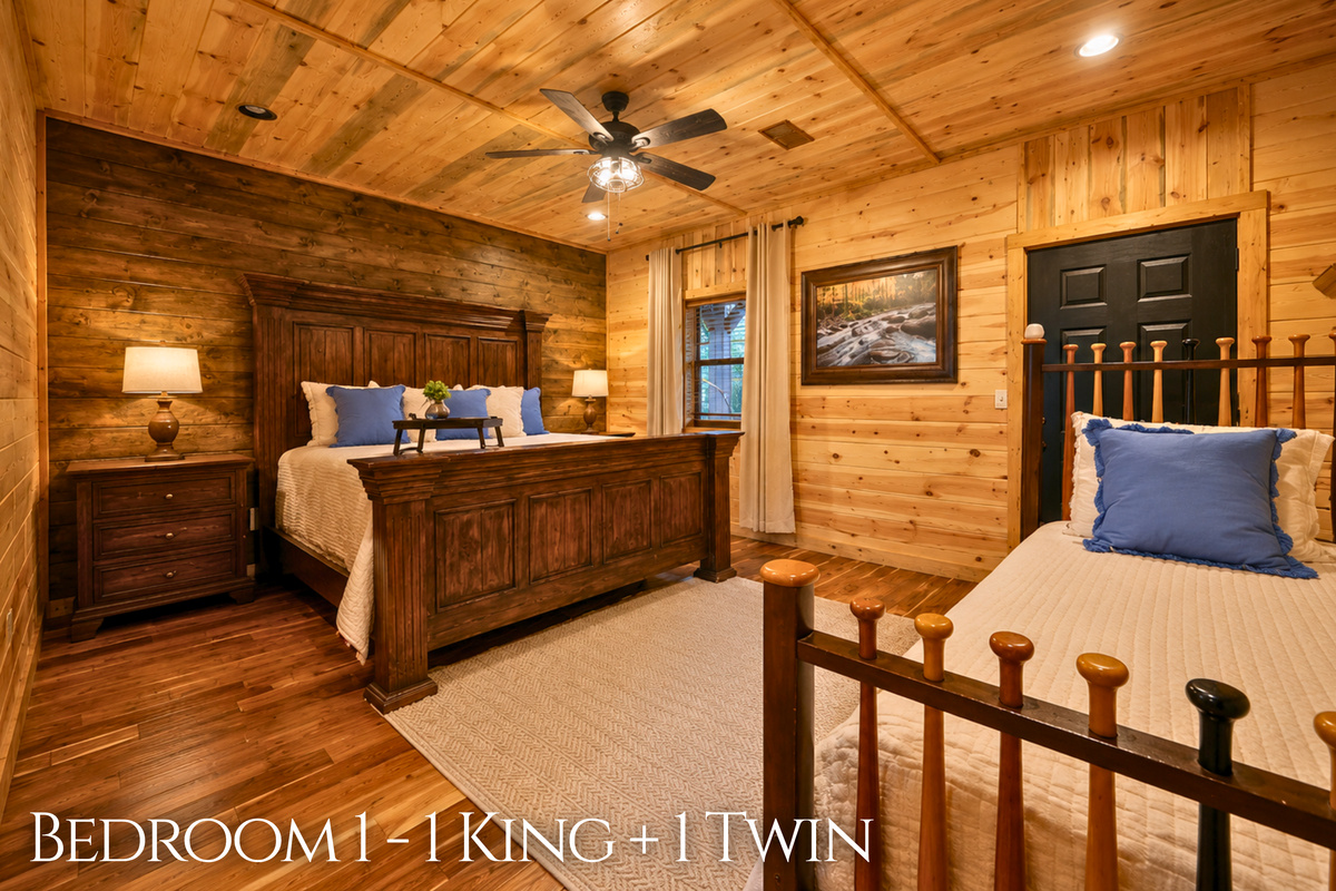 Featuring a king bed alongside an additional twin bed, this bedroom offers a comfortable setup for couples, families, or small groups.