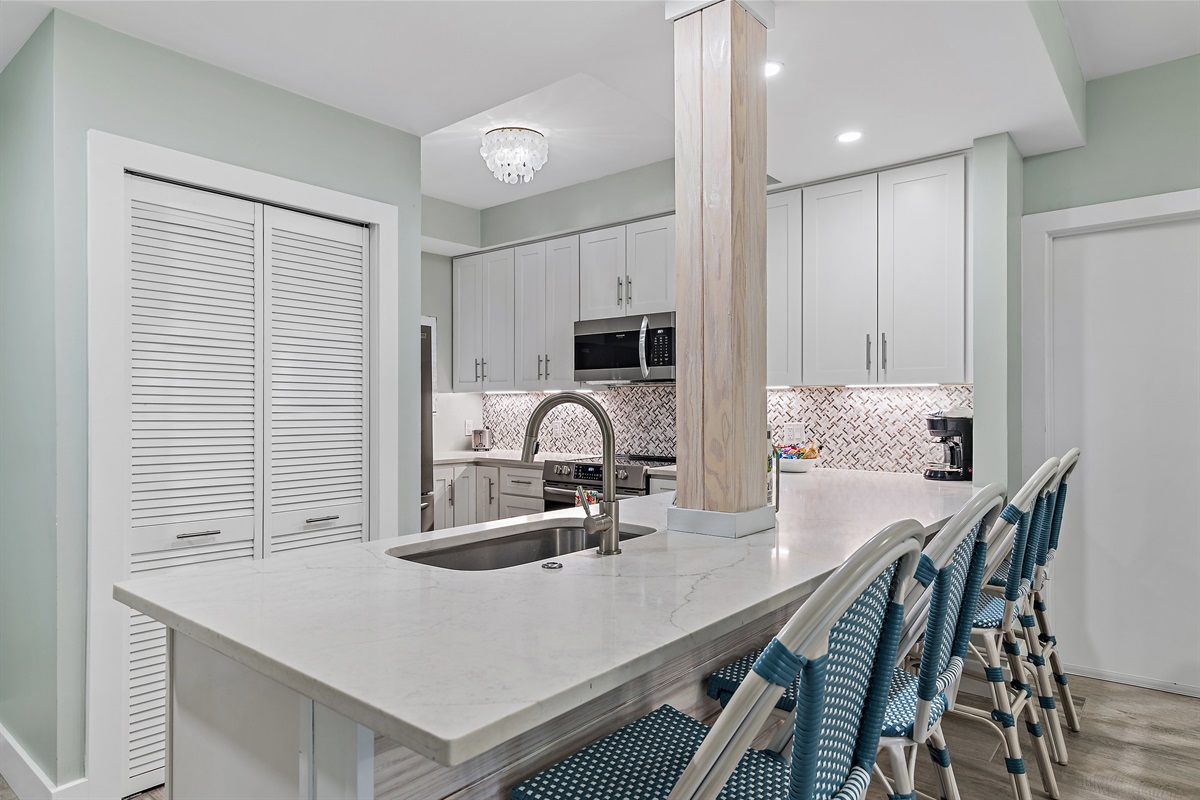 Remodeled Kitchen with bar seating come fully-stocked for you to prepare meals in your home away from home!