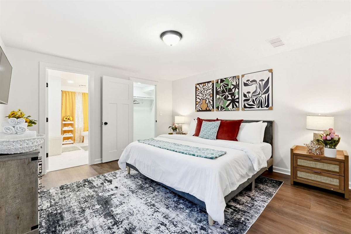 Finally, the basement bedroom features a beautiful, cool-toned color scheme with natural accents, a king bed, and a Roku-powered Smart TV. This room includes 2 full-body towels, 2 washcloths, and 2 hand towels for your stay.