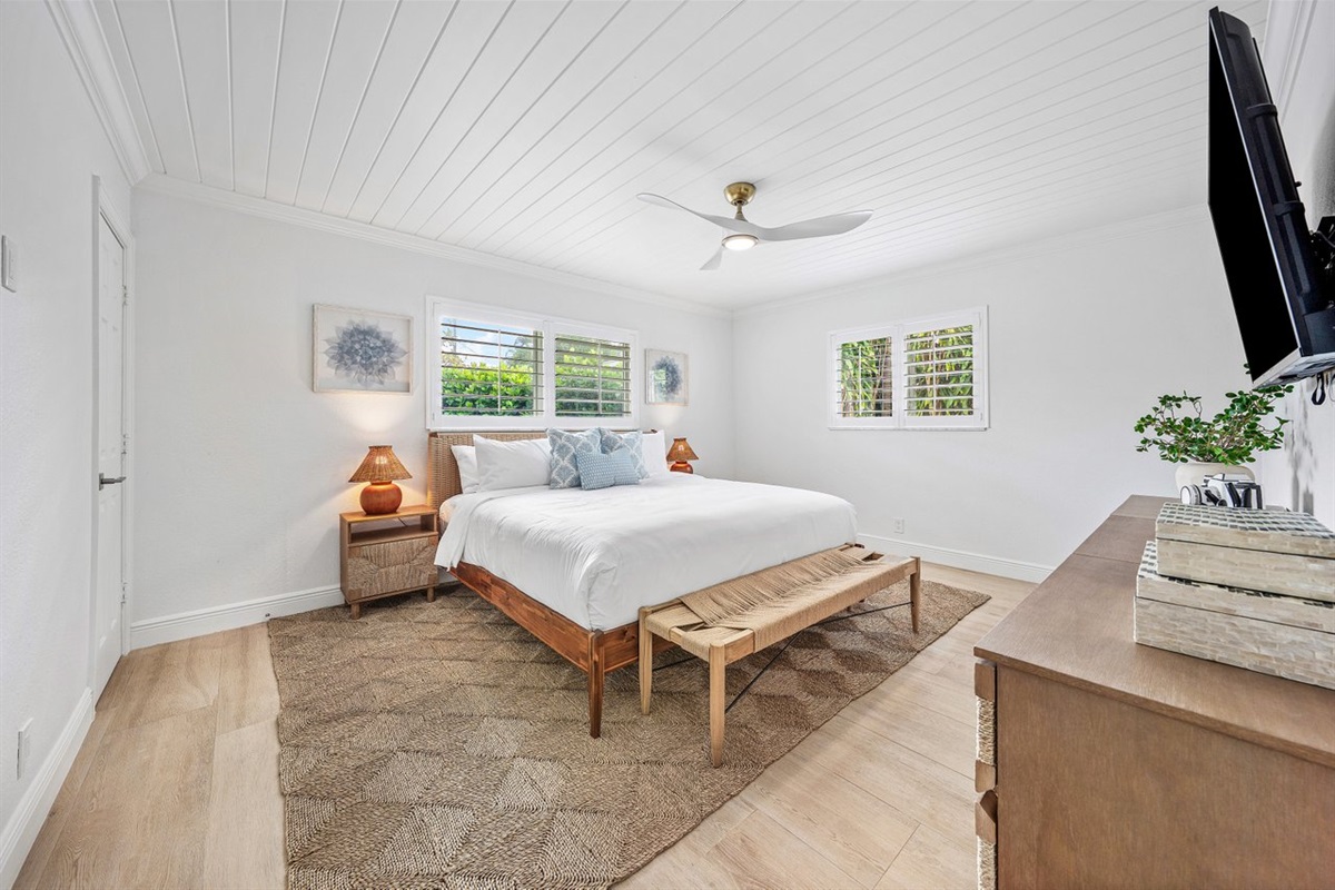 Bright and inviting with a relaxed beach house feel, this spacious bedroom blends comfort, style, and tranquility.