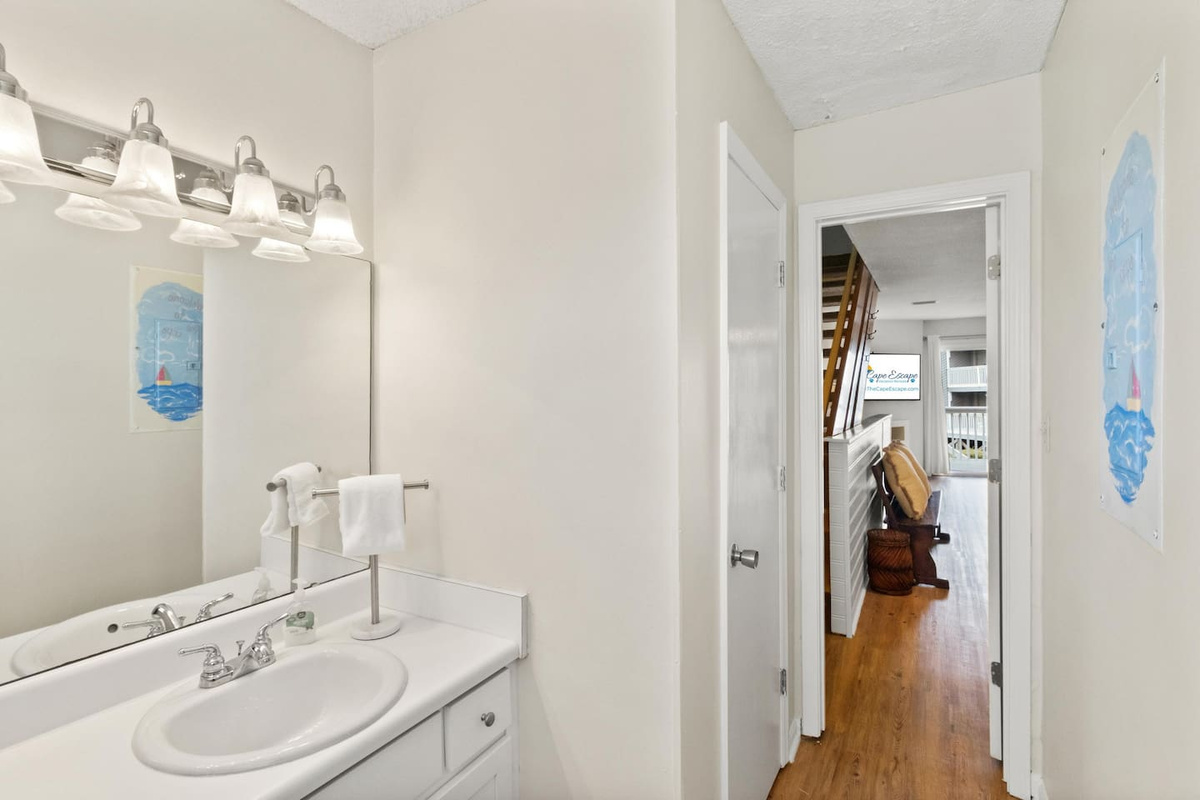 Find the main-level half bath right where you need it &mdash; no one has to trek upstairs during the beach-day rush.