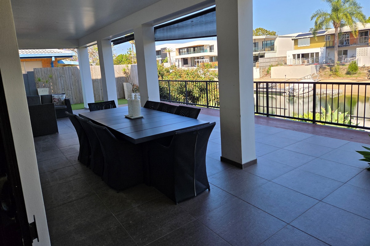 Outdoor dining and lounge overlooking canal