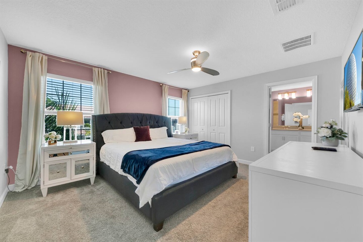 The master bedroom, with a king bed and a private full bathroom
