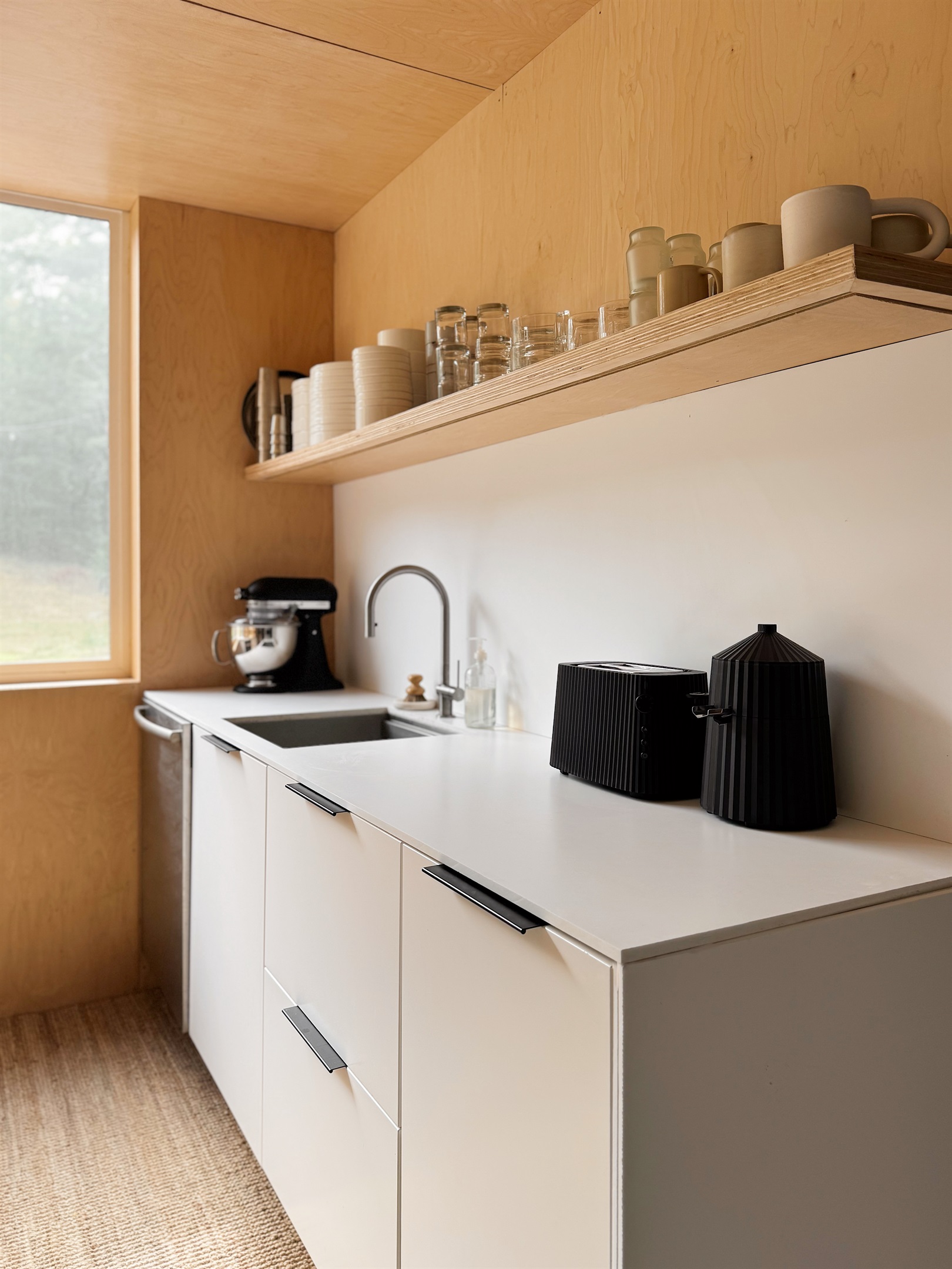 Kitchen with Kitchenaid mixer and Alessi juicer.