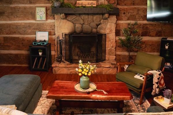 Snuggle up by the stone fireplace, creating the perfect cozy atmosphere