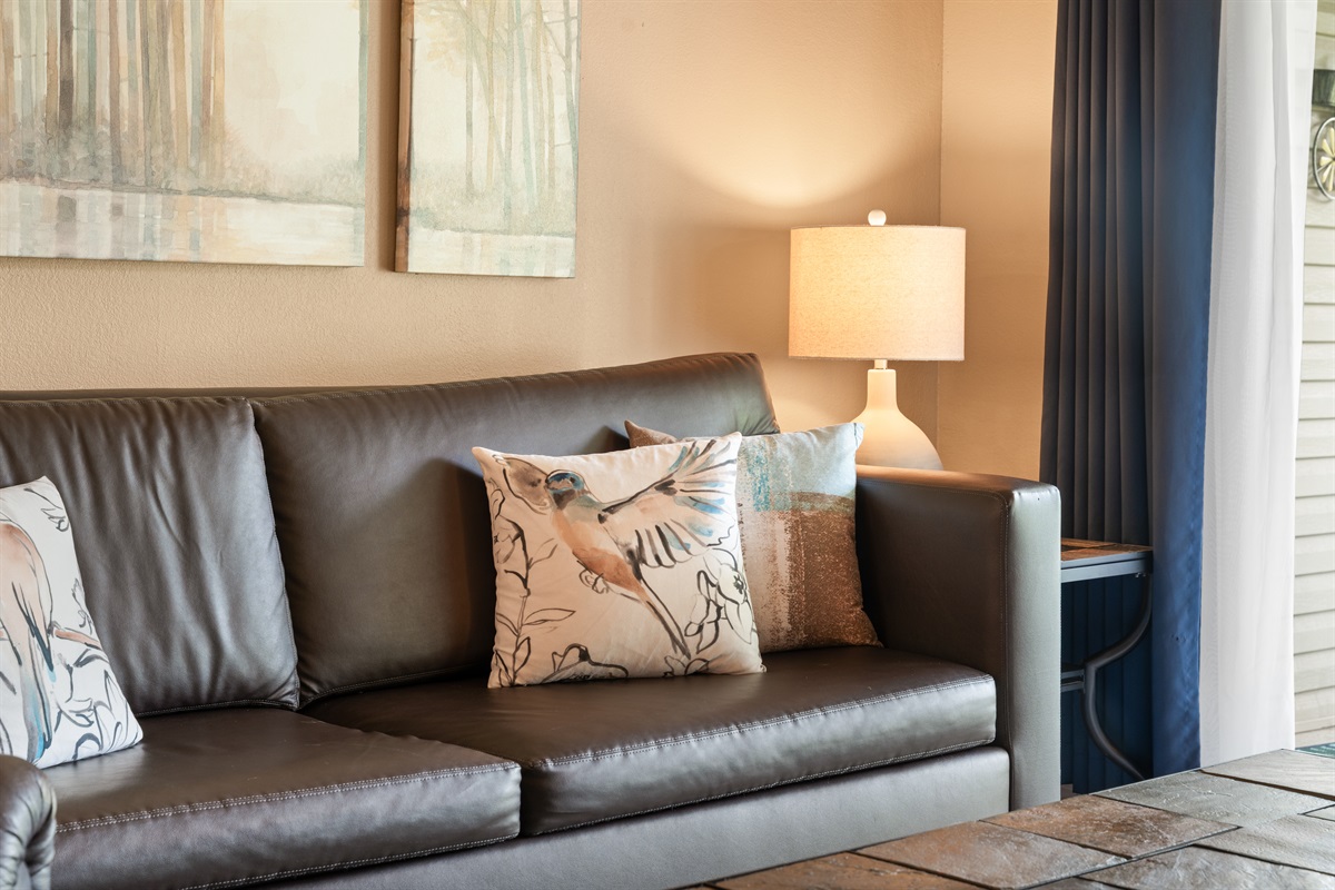 Soft lighting and warm textures help the main living space feel inviting from the moment you walk in.