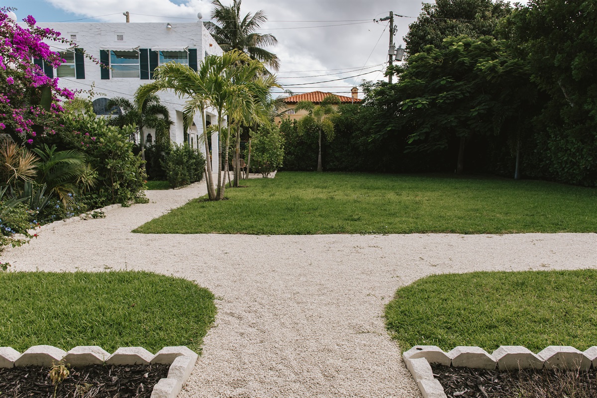 The garden of The Marisol features a spacious lawn, a walking path, hand-selected plantings and cozy, relaxing seating areas to take in the full beauty of the grounds.