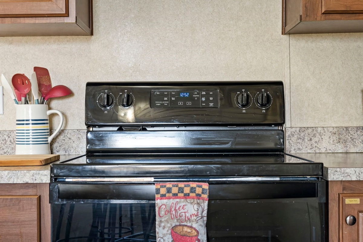 Modern electric stove and oven setup, ideal for preparing everything from quick meals to home-cooked dinners.
