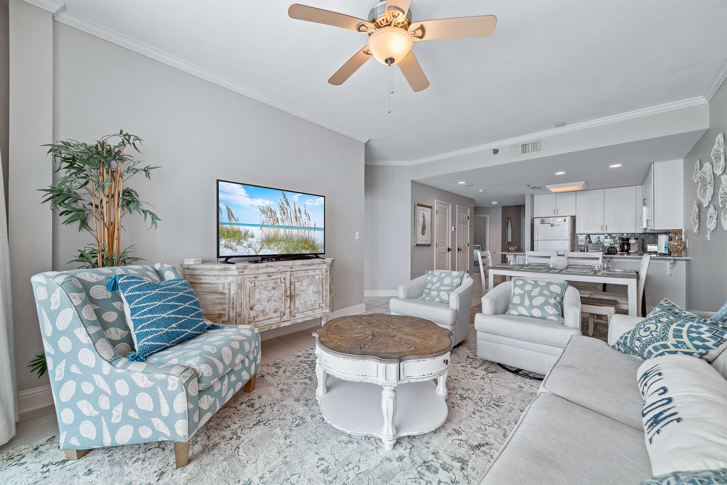This well-appointed living space offers plush seating, elegant coffee table, and a dining area with seating for six, creating a welcoming atmosphere.