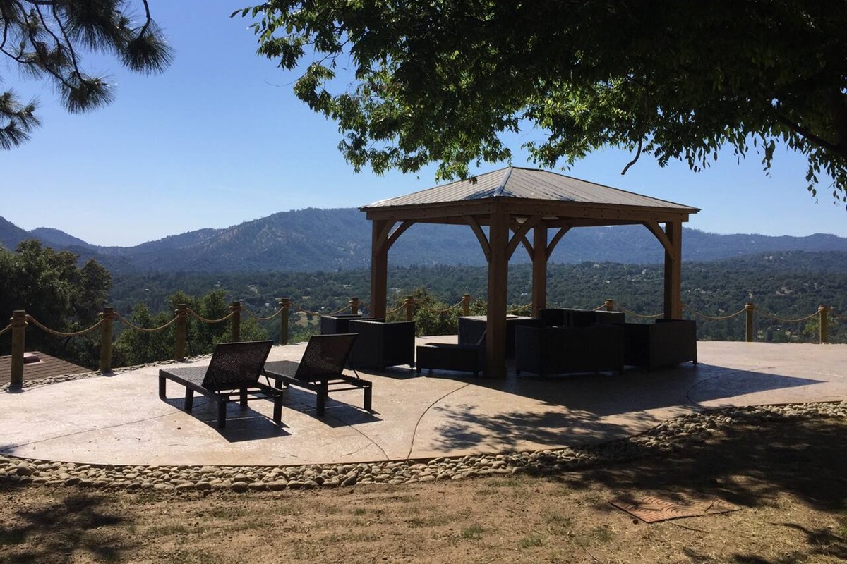 Gazebo with patio furniture and propane fire pit