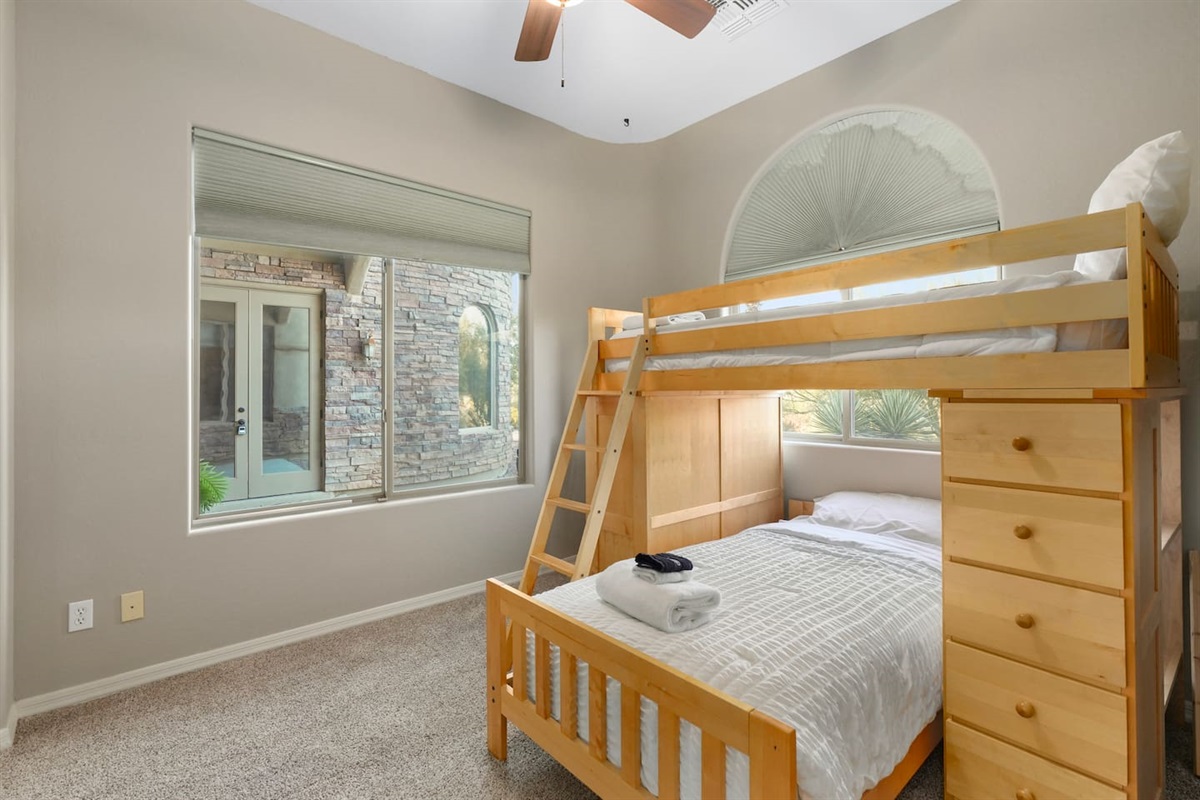 Bright bunk bedroom featuring natural light, desert views.
