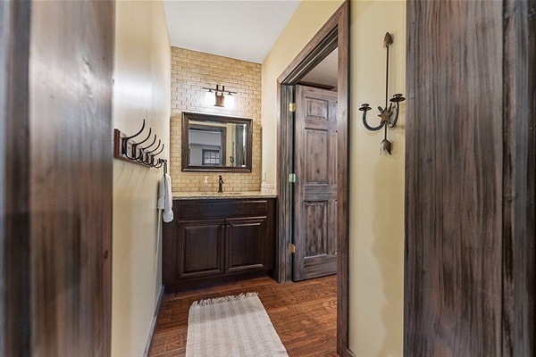 Separate sink area to the lower level bathroom with door for added privacy