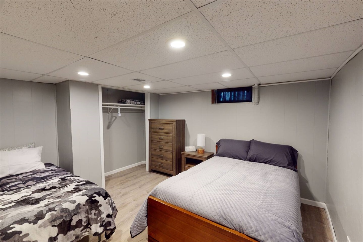 Bedroom #7 with a queen and twin bed.