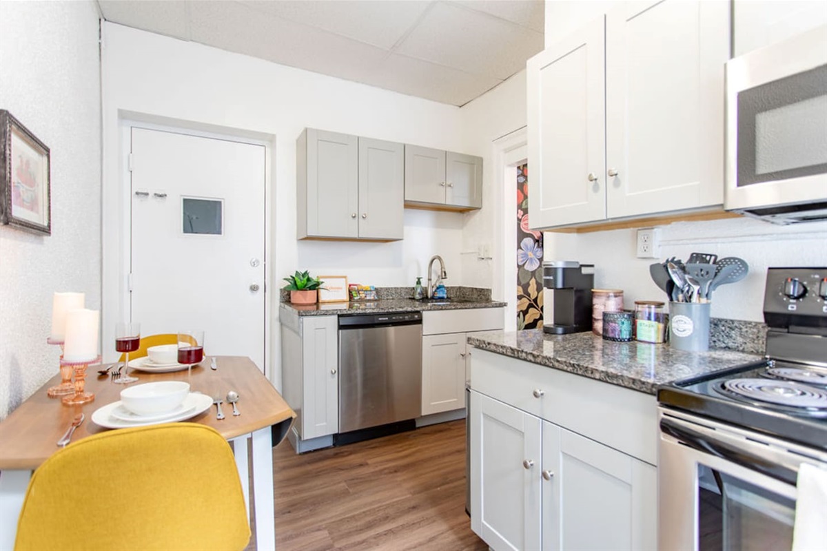 Full kitchen featuring sleek, modern stainless steel appliances for a stylish and functional cooking space.
