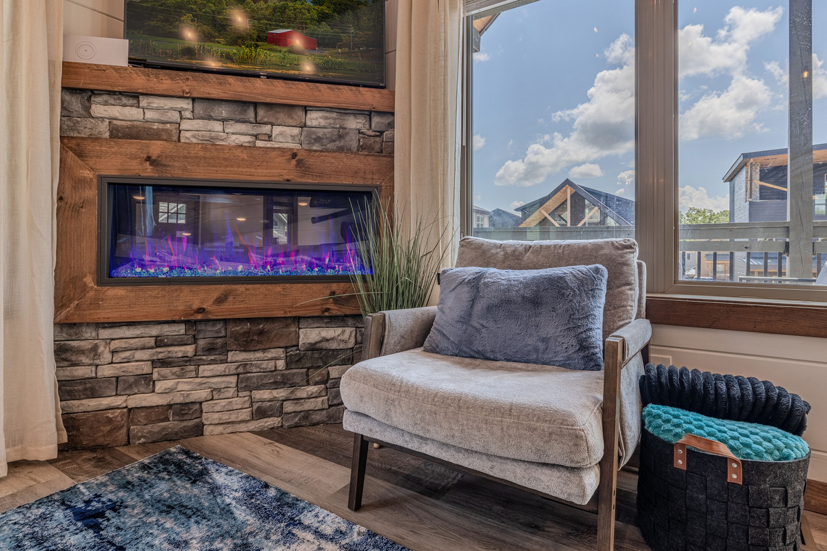 Cozy up beside the electric fireplace in the main living area.