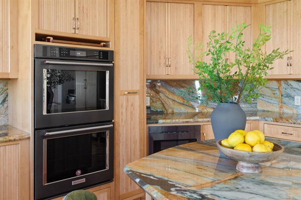 A true culinary retreat featuring top-tier appliances, gorgeous stone finishes, and all the prep space your group needs.