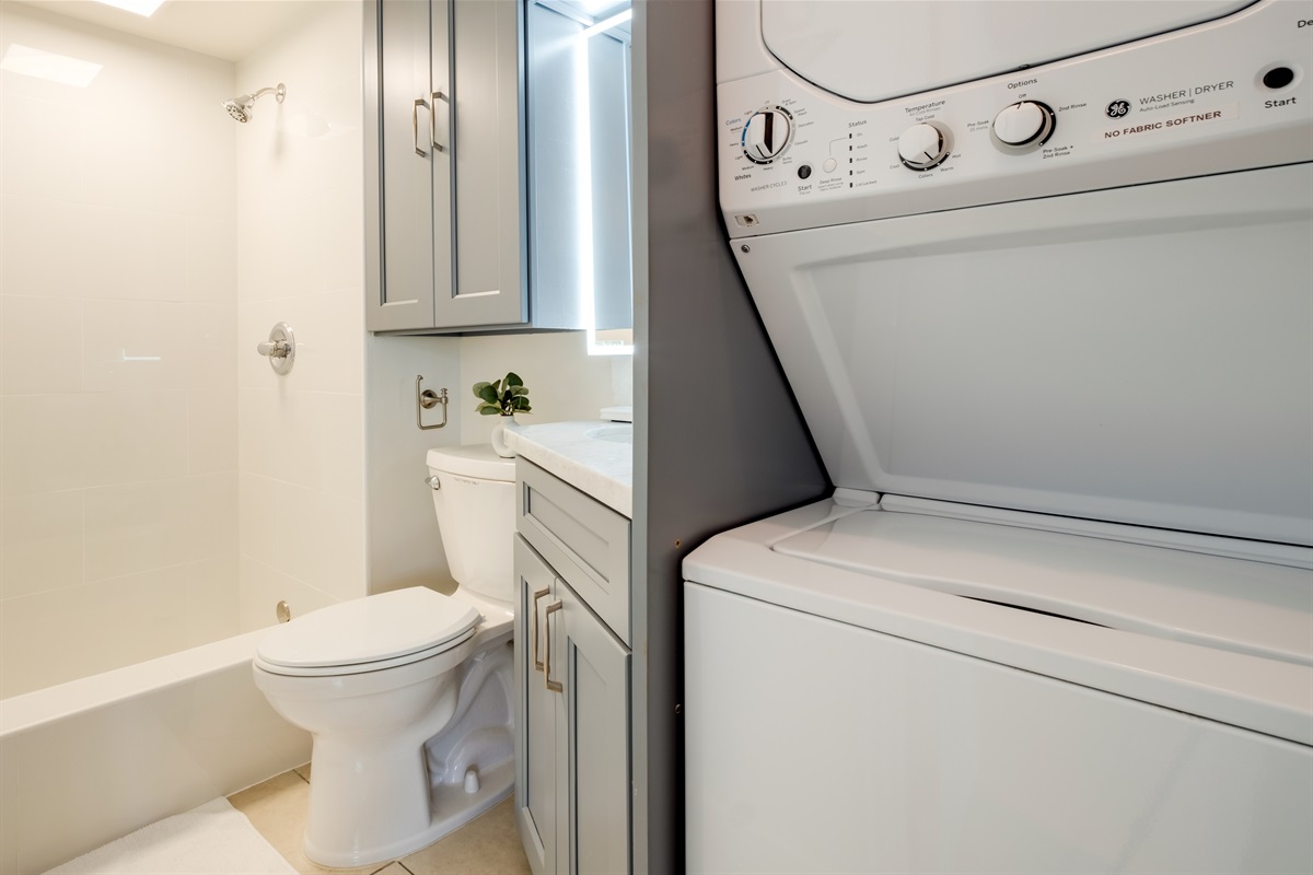 Enjoy the convenience of in-unit laundry and a bright, spa-inspired bath — perfect for extended stays or a refreshing rinse after a day at the beach. Modern finishes and thoughtful touches make this Waikīkī retreat as practical as it is relaxing.