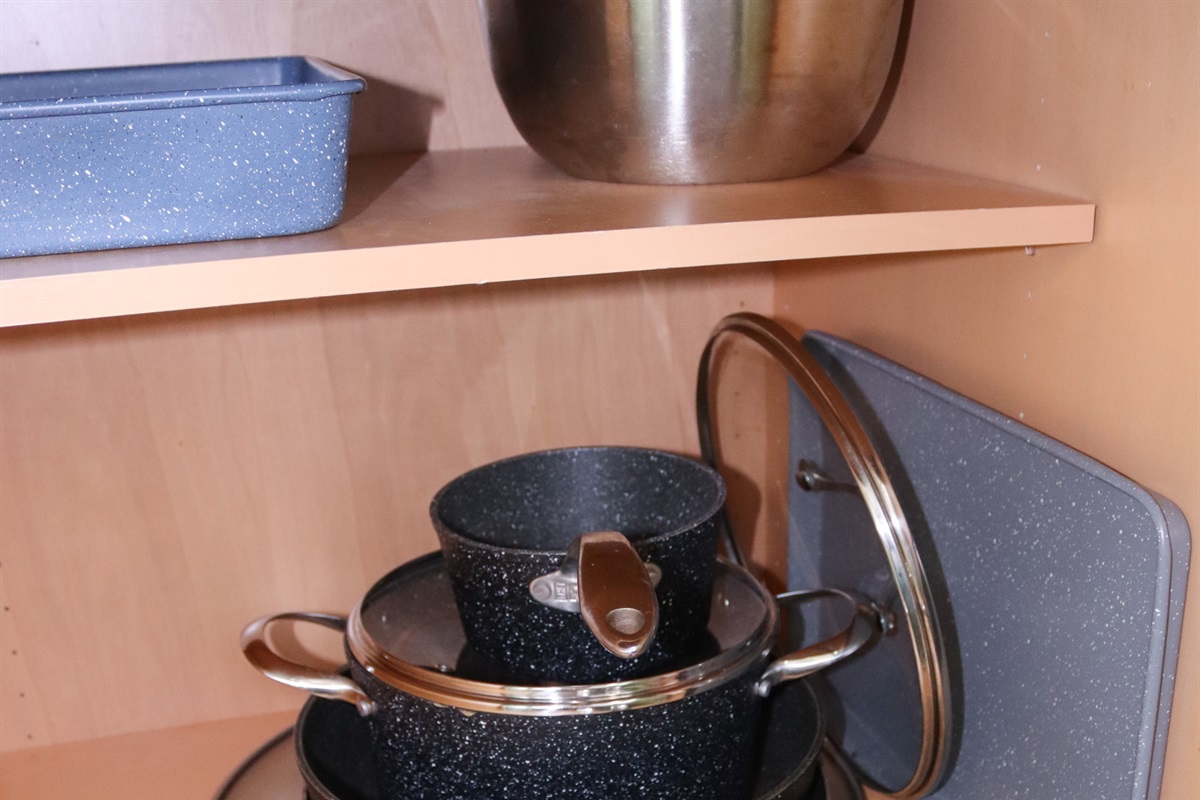 Fully stocked with cookware, dishes, and utensils