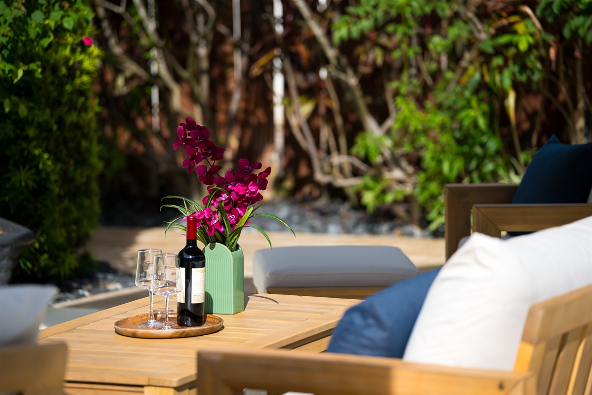 Escape the midday sun under the large cantilever umbrella and enjoy your favorite game on the outdoor TV.