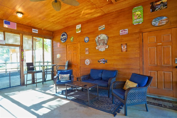 Screened-in patio with seating — bug-free lake breezes year-round.