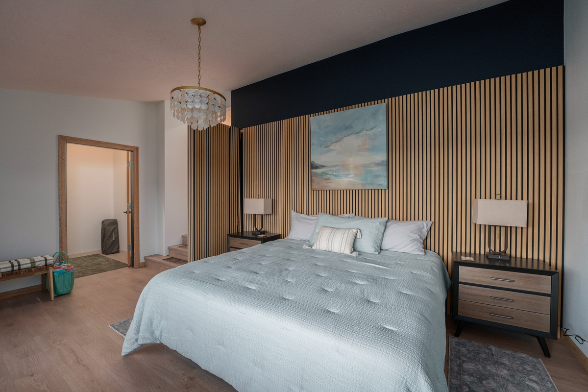 Wake to peaceful lake views from this king bedroom for two, complete with an adjoining nursery and convenient access to Bathroom 3, shared with Bedroom 3.