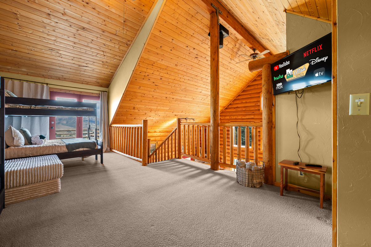 Open loft overlooking the cabin below with abundant room to spread out and relax.