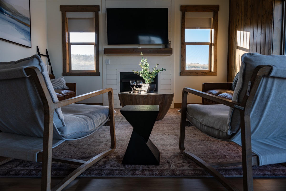 Elegant living space with a warm fireplace, stylish décor, and the perfect setting for relaxing evenings with a view.