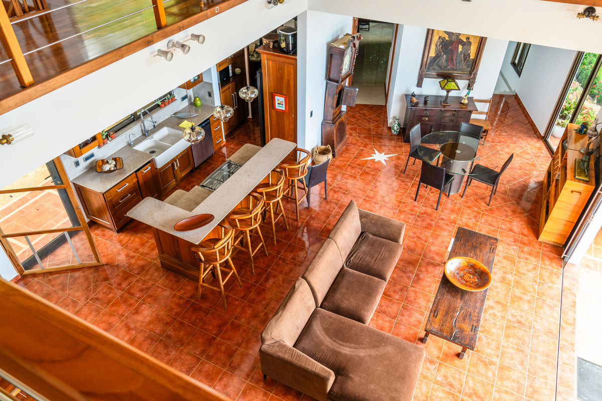 Open-concept living and dining area with bar seating — designed for gathering and entertaining
