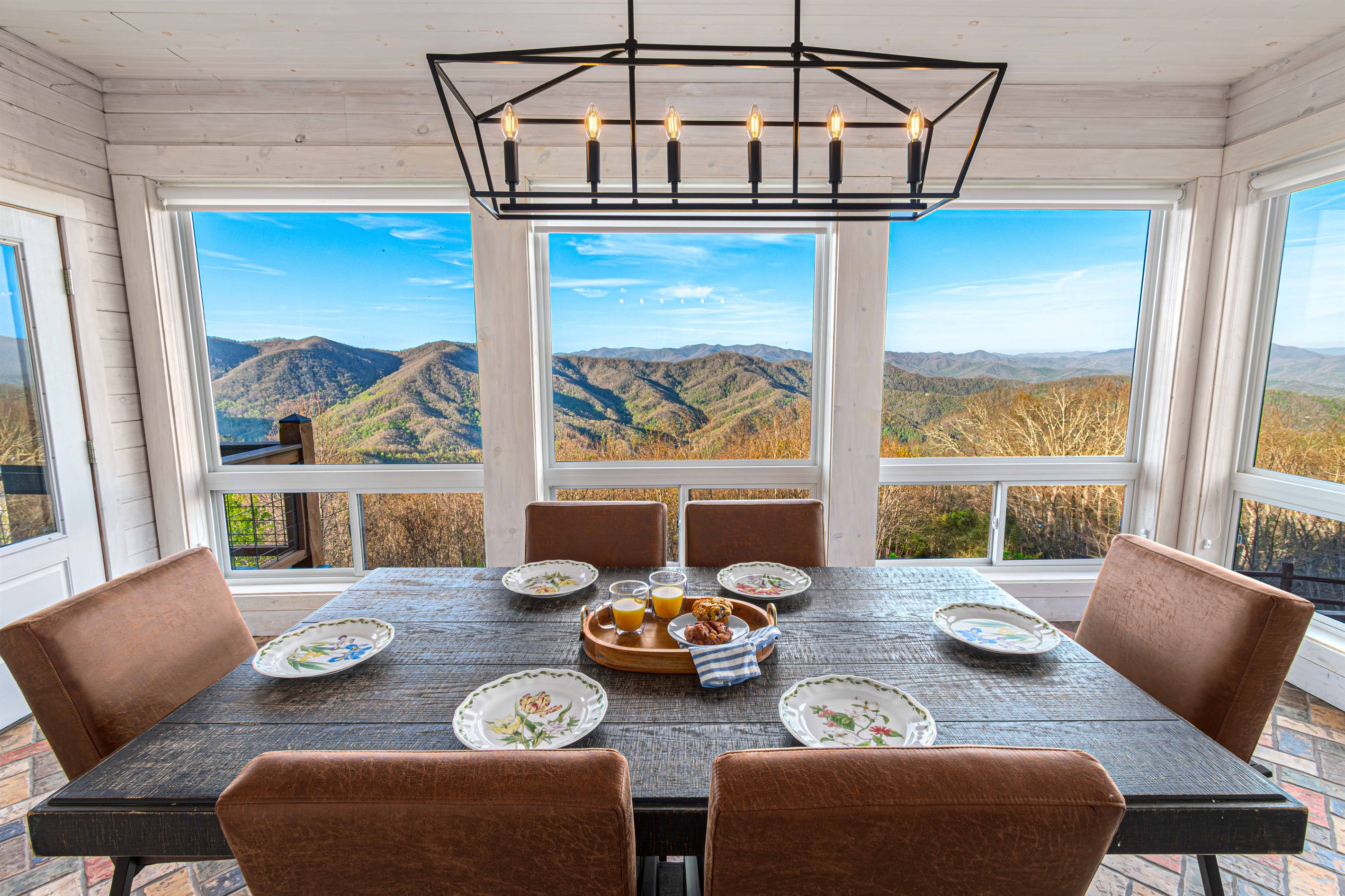 Dining Area: Savor mountain views with meals at this stylish table in a bright, airy space!