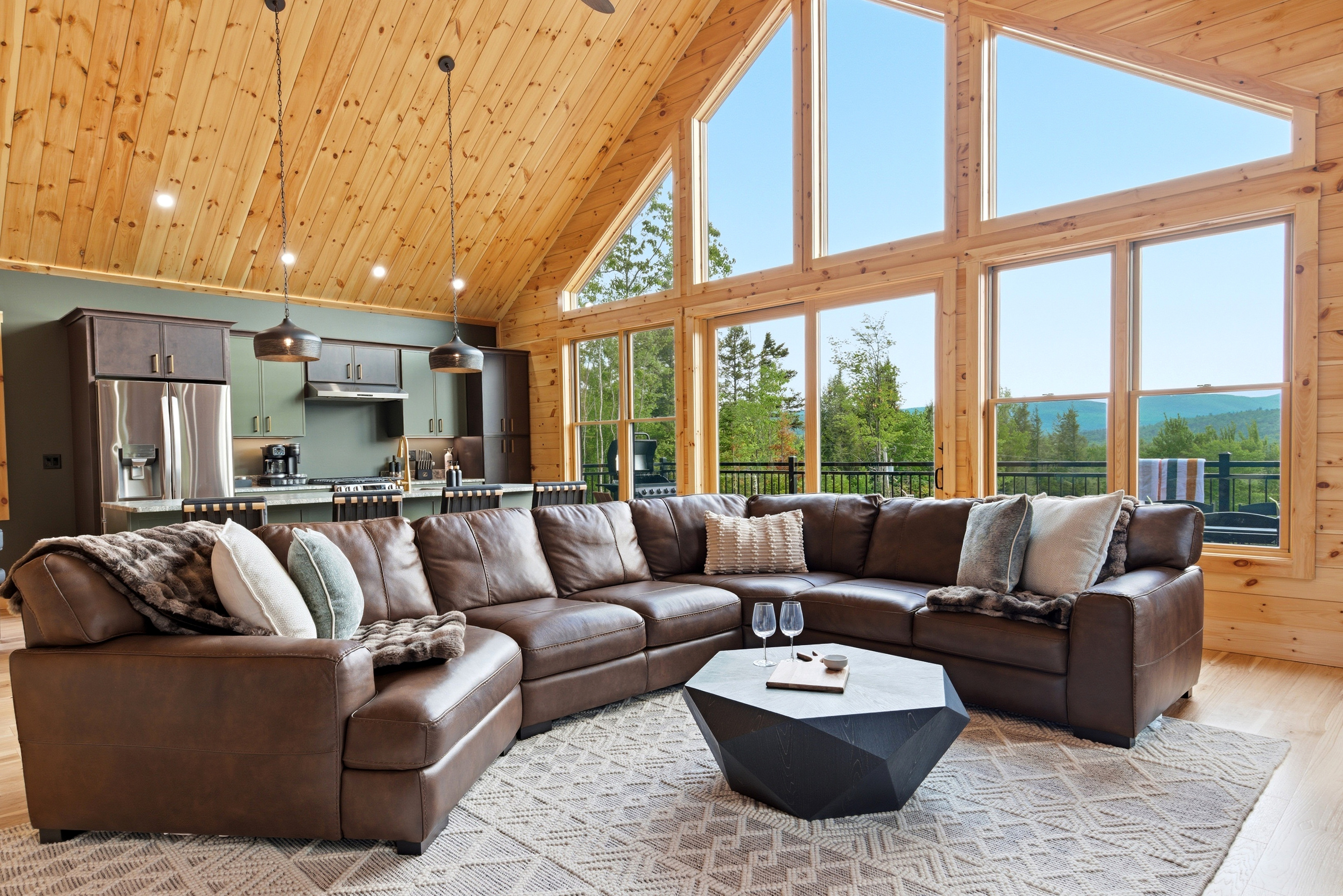Stretch out on the spacious sectional and take in the views through dramatic floor-to-ceiling windows.
