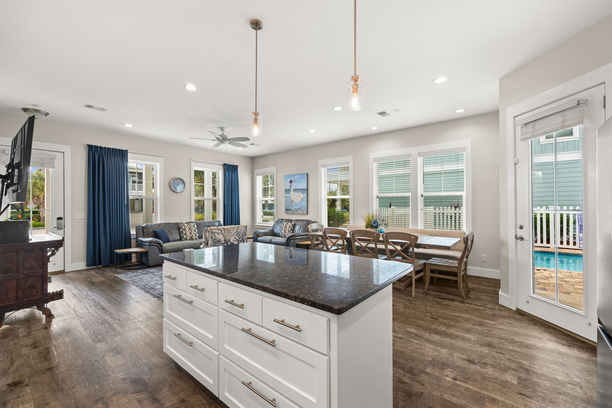 Fully stocked kitchen with granite countertops, stainless appliances & brand-new refrigerator added in 2026