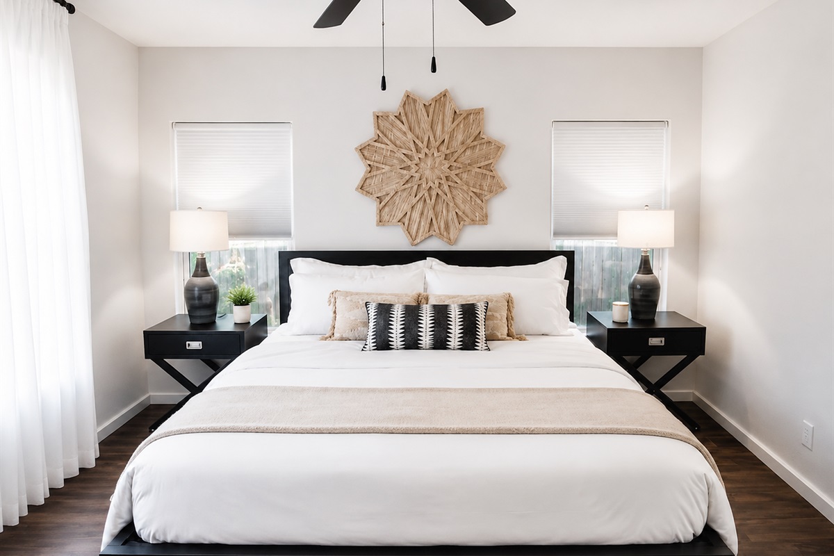 Elegant king bedroom featuring upscale furnishings, layered textures, and a peaceful retreat-like feel