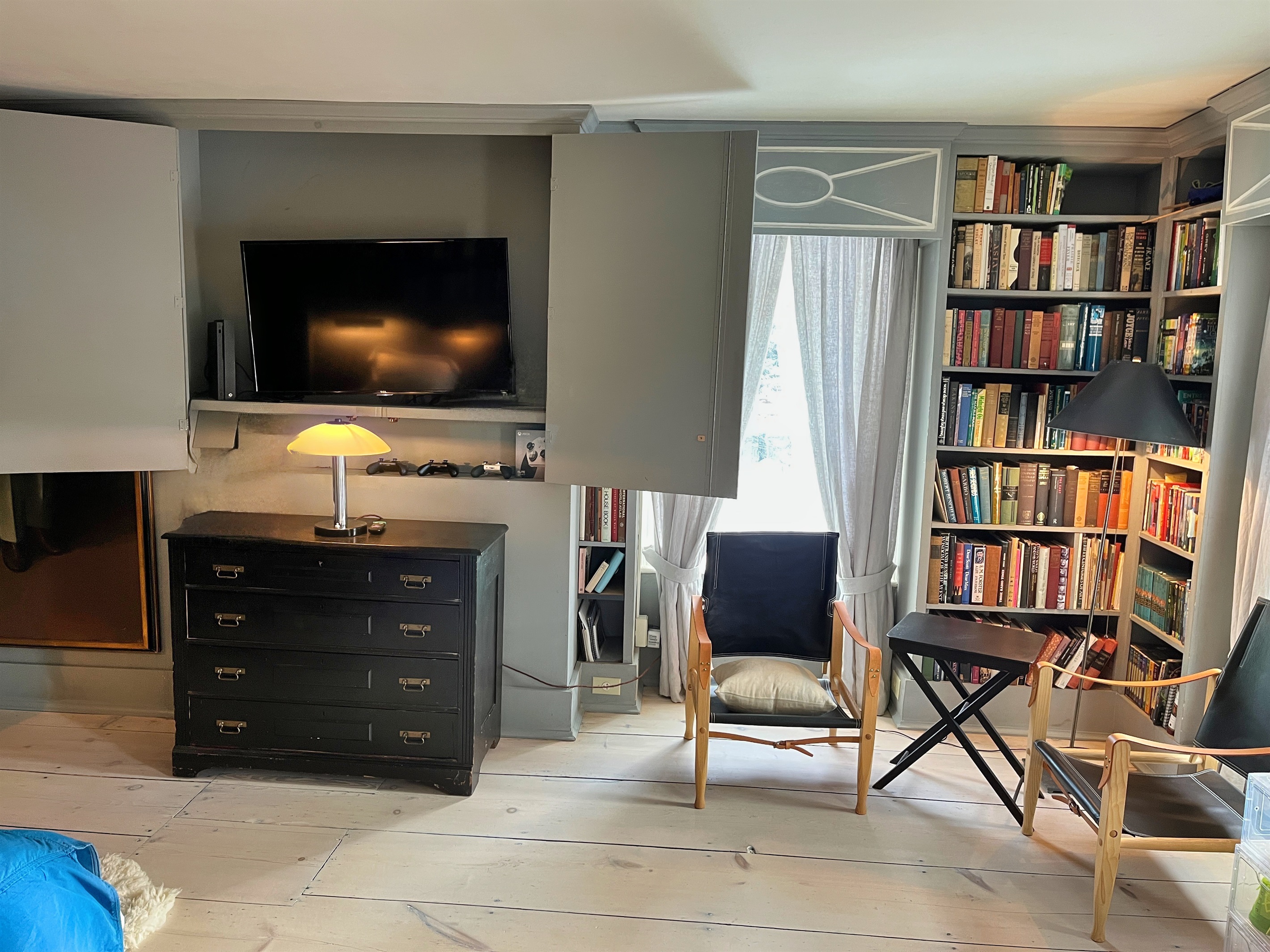 Hawk Field House - 2nd floor bedroom with hidden smart TV.