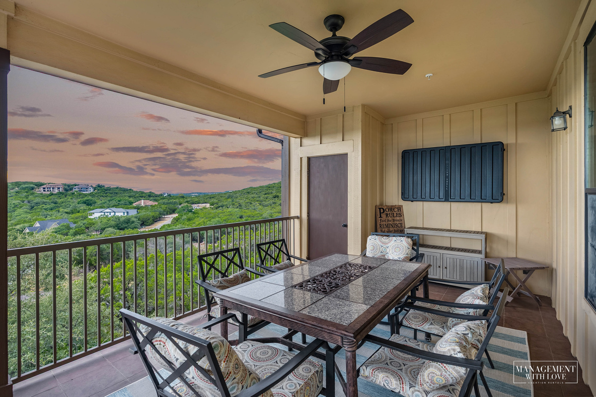 Outdoor dining with Lake Travis and Hill Country views.