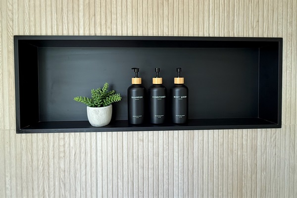 Large modern niche in the main level master en suite. Shampoo, conditioner and body wash provided in each shower