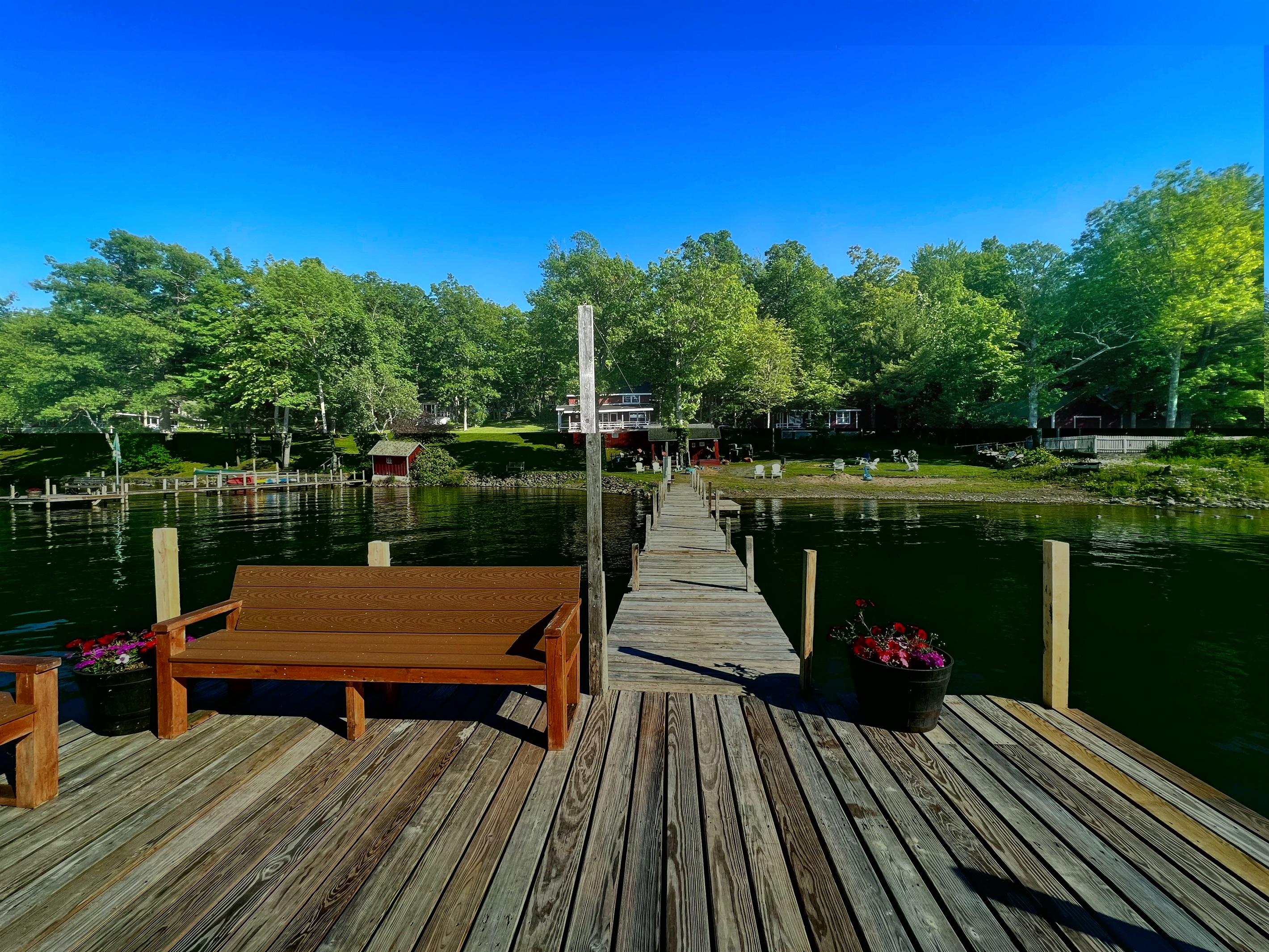 Hyde Bay Colony swim dock with benches to sit and enjoy the view.