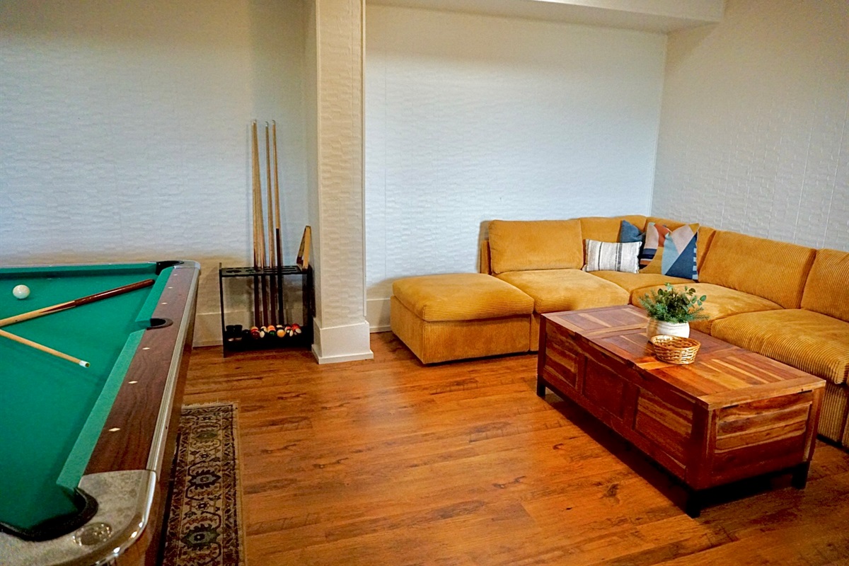 Enjoy vibrant pool matches and cozy gatherings in this inviting lounge space!
