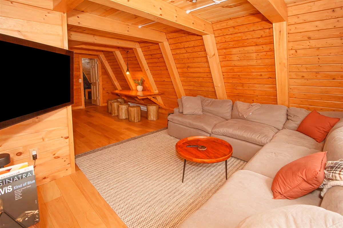 Living room with Smart TV and reclining couch