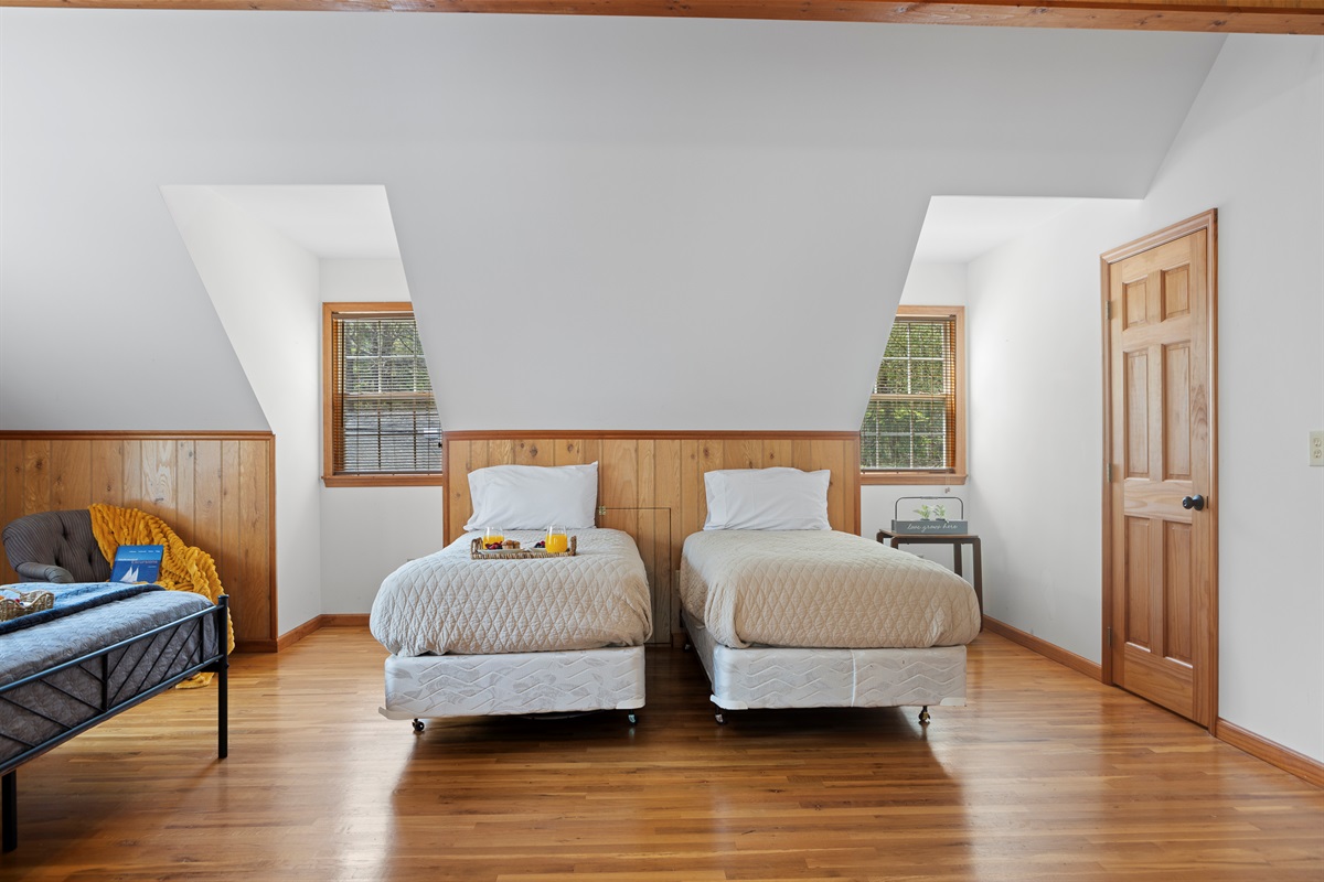 Queen Bedroom 3: Bright and airy retreat with twin beds and rustic charm—perfect for unwinding!