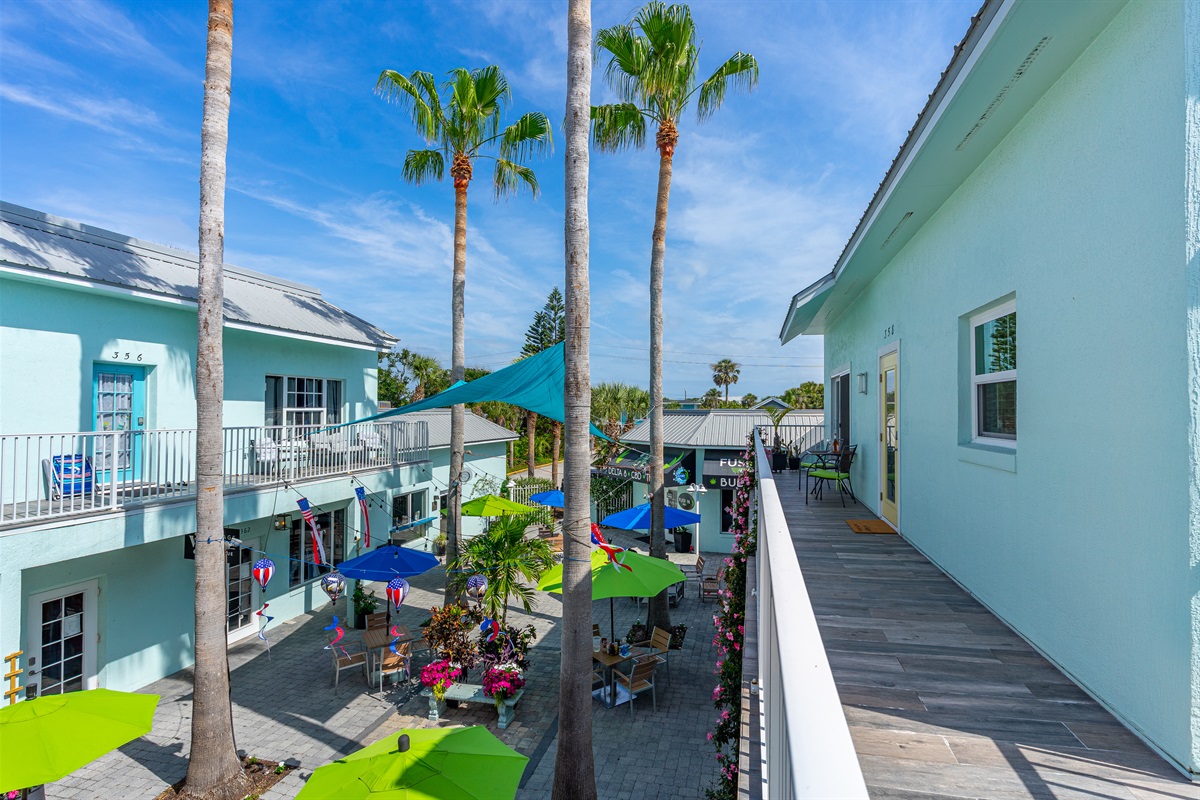 Balcony overlooking community courtyard with shops and restaurants!