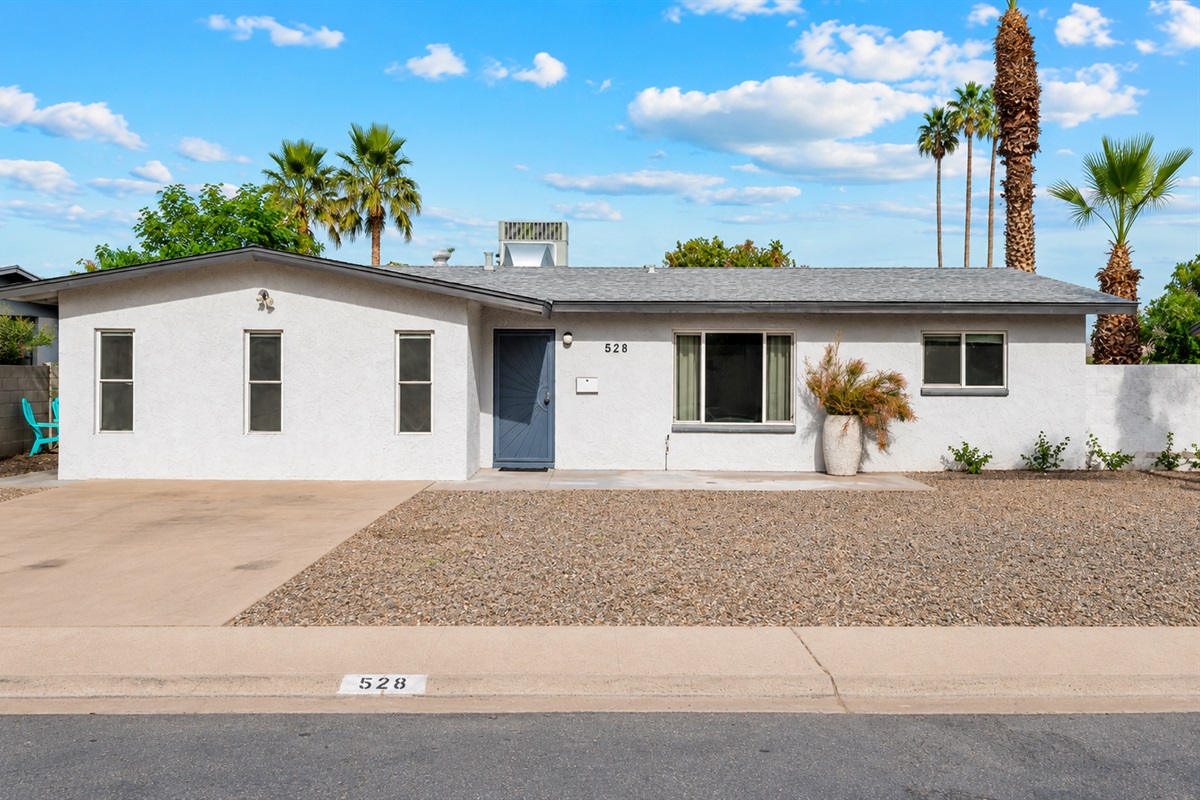 Single level home with desert landscape