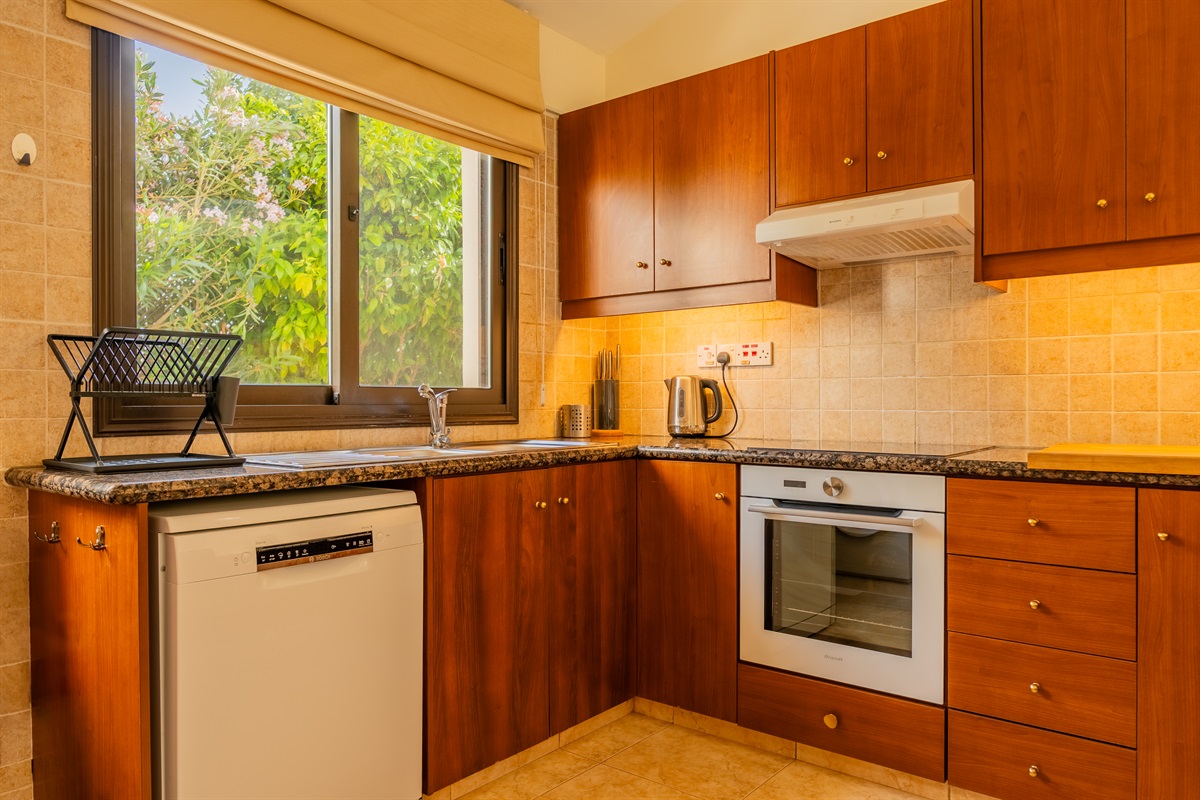 Large open kitchen with high ceilings, equipped with washing machine, dishwasher, microwave, oven, fridge, stove, toaster (big enough for local pita bread!), citrus juicer, coffee machine, Nespresso machine, water boiler, blender, panini/haloumi grill, etc