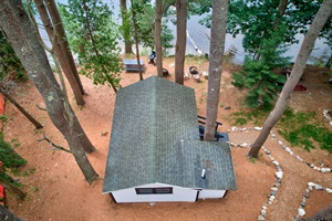 Aerial top view of the cabin with lake view