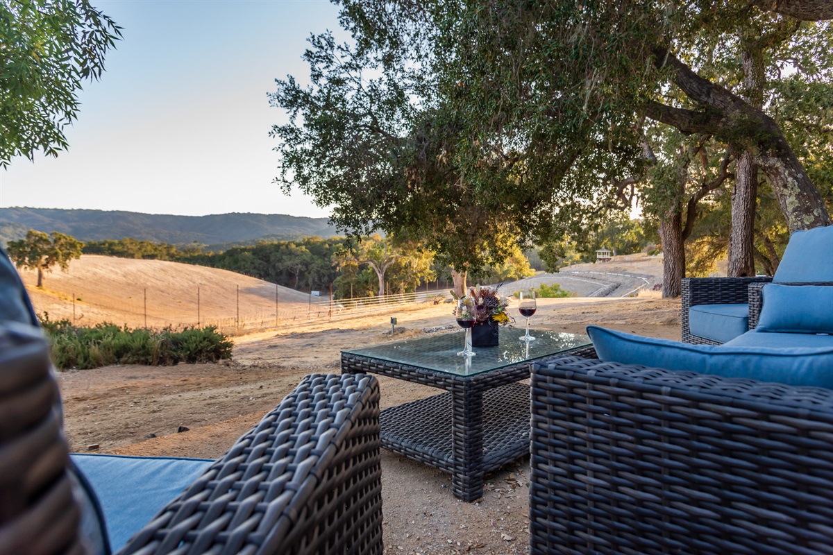 Savor a glass of wine while overlooking the hills.