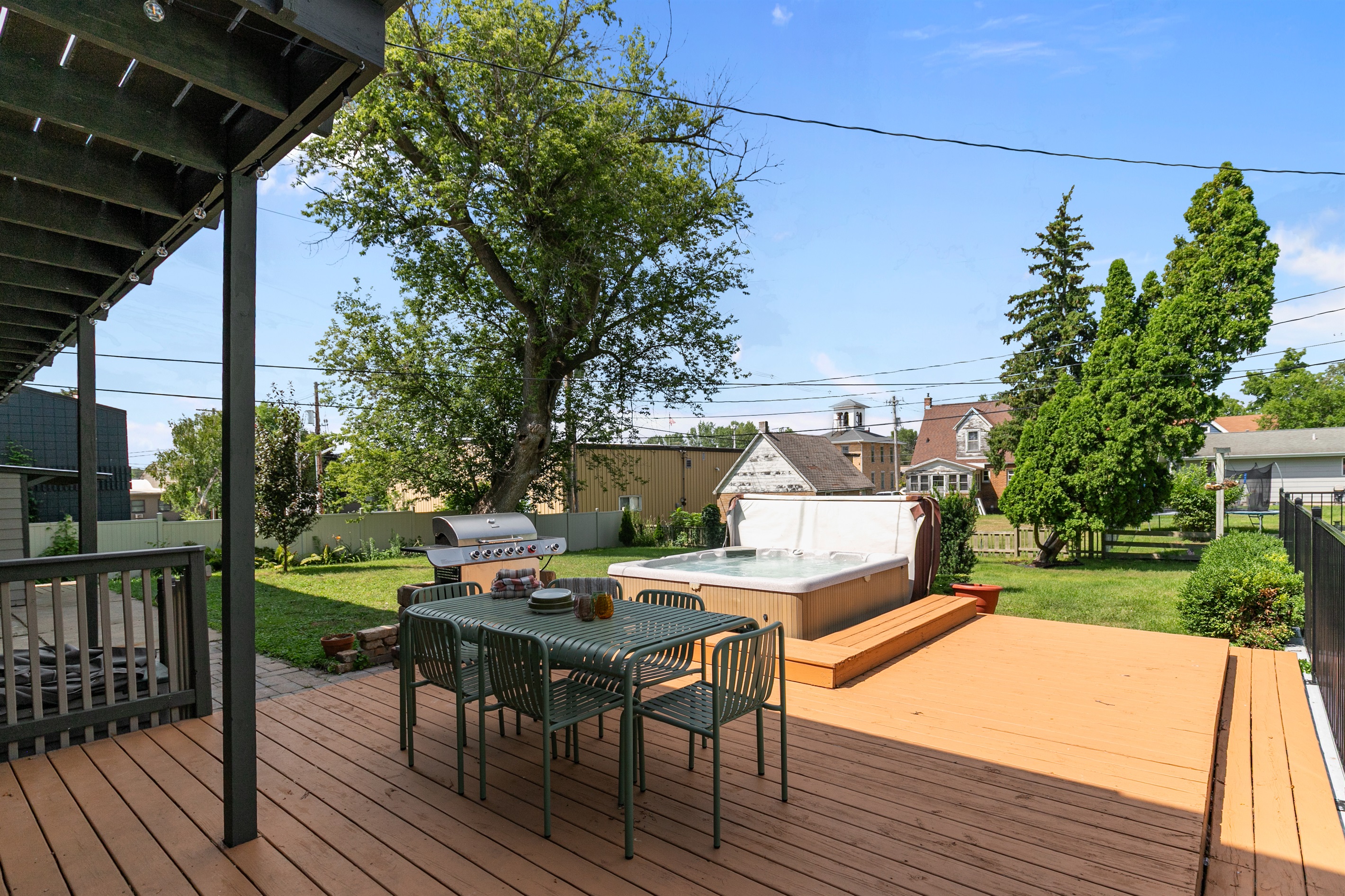 The deck features a welcoming outdoor seating area, perfect for dining together while enjoying the fresh air and views.