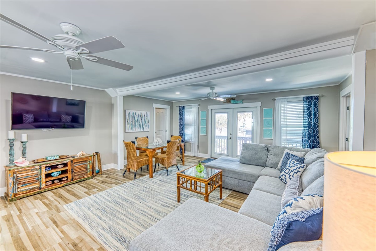 Living Room: Bright and airy retreat with stylish decor and delightful views of Fort Morgan!