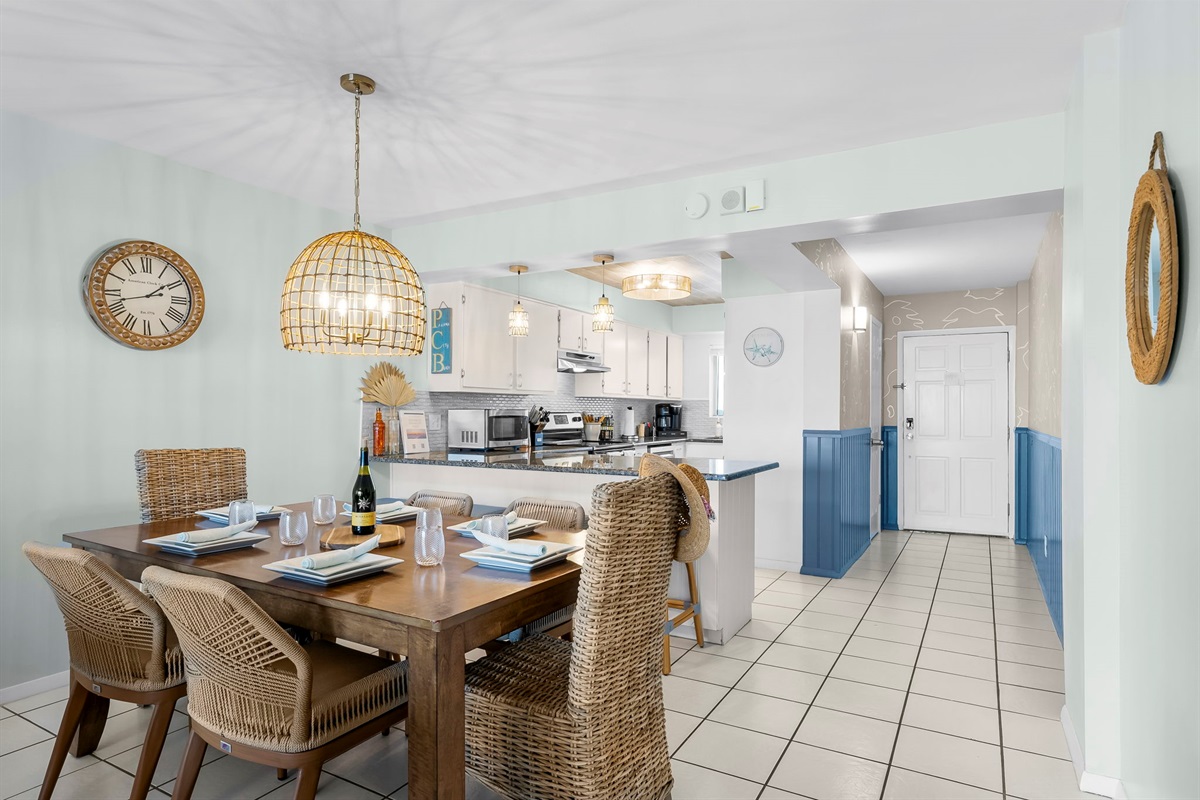 The dining area offers new chairs, cups, plates, outdoor dinnerware, and all the essentials you'll need to gather around the table together .