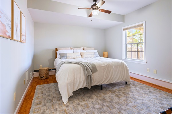 Welcome to our second basement bedroom, featuring a plush king bed—perfect for a restful night’s sleep!