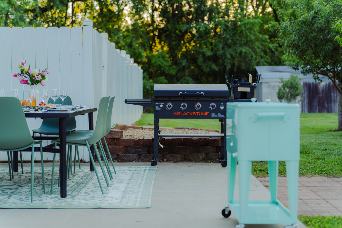 Outdoor dining surrounded by lush trees and the natural beauty of Hocking Hills.