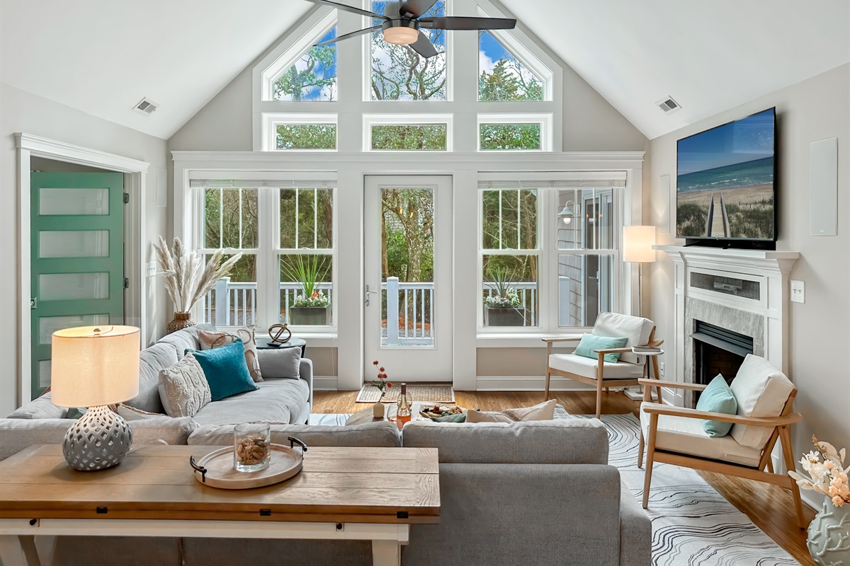 A stunning cathedral ceiling, a light and airy living room...